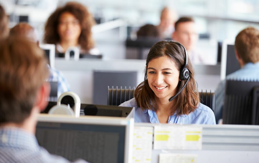 openphone alternatives - a woman in a call center using voip app