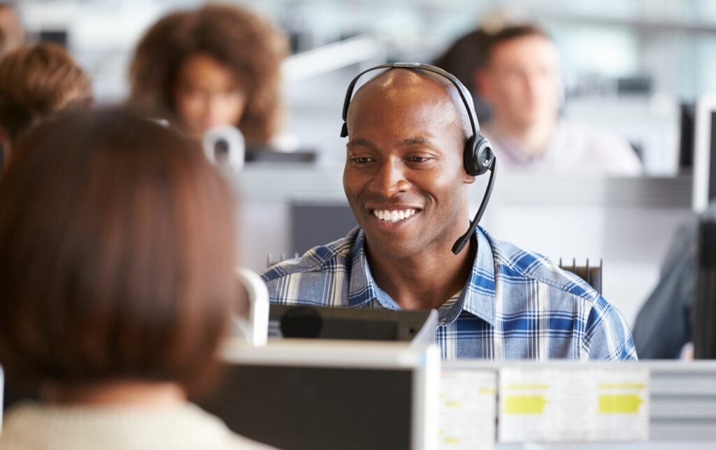 young man on voip phone in office